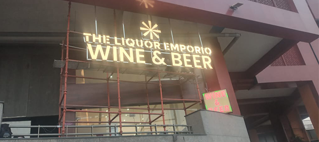 Liquor bottle display rack in Indian wine shop, New Delhi