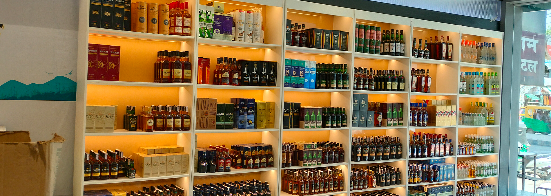 Warm and neutral LED lighting in liquor display racks for premium bottle presentation