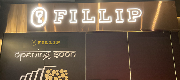 Liquor bottle display rack in a modern Indian wine shop for better product visibility, New Delhi