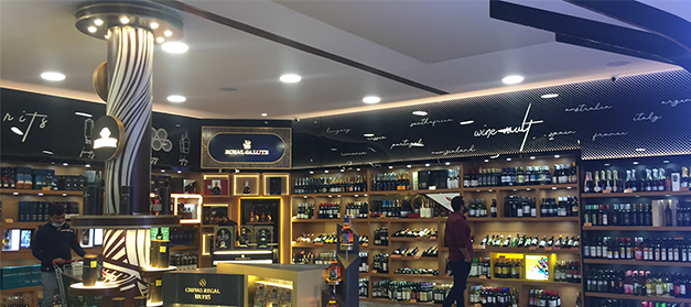 Liquor bottle display rack in Indian wine shop, New Delhi