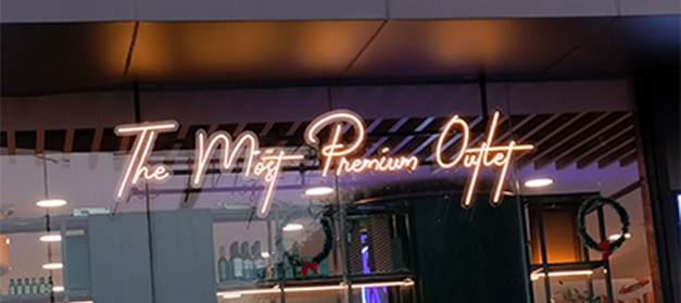 Liquor bottle display rack in a modern Indian wine shop for better product visibility, New Delhi