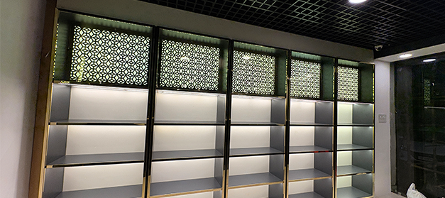 Liquor bottle display rack in a modern Indian wine shop for better product visibility, New Delhi