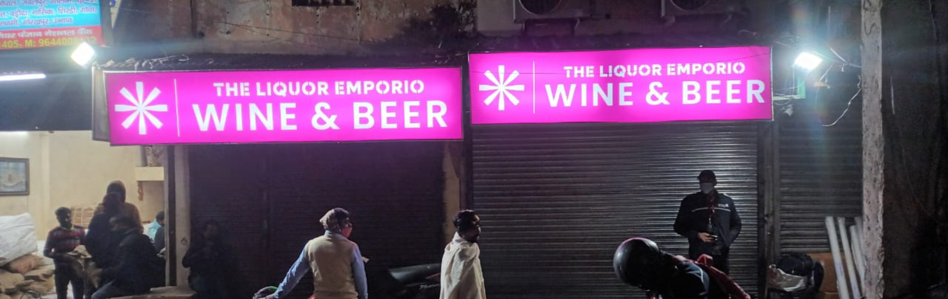 The Liquor Emporio Gokhale Market glow sign board in New Delhi