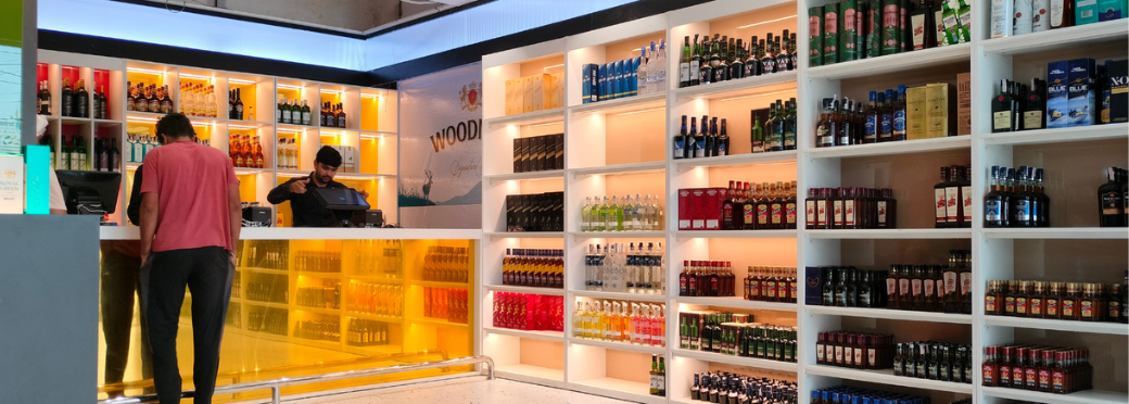 Liquor shop display rack with organised bottle storage