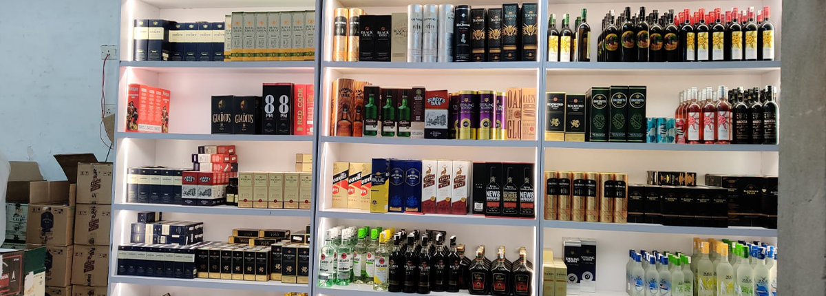 Liquor store wall rack with LED lighting by Baba SuperSign