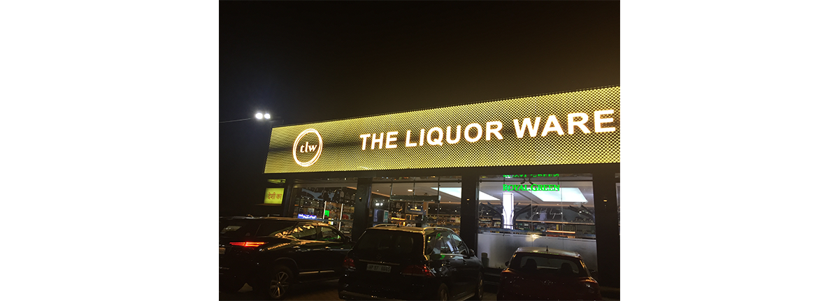 Backlit luxury retail signage with acrylic and metal finish
